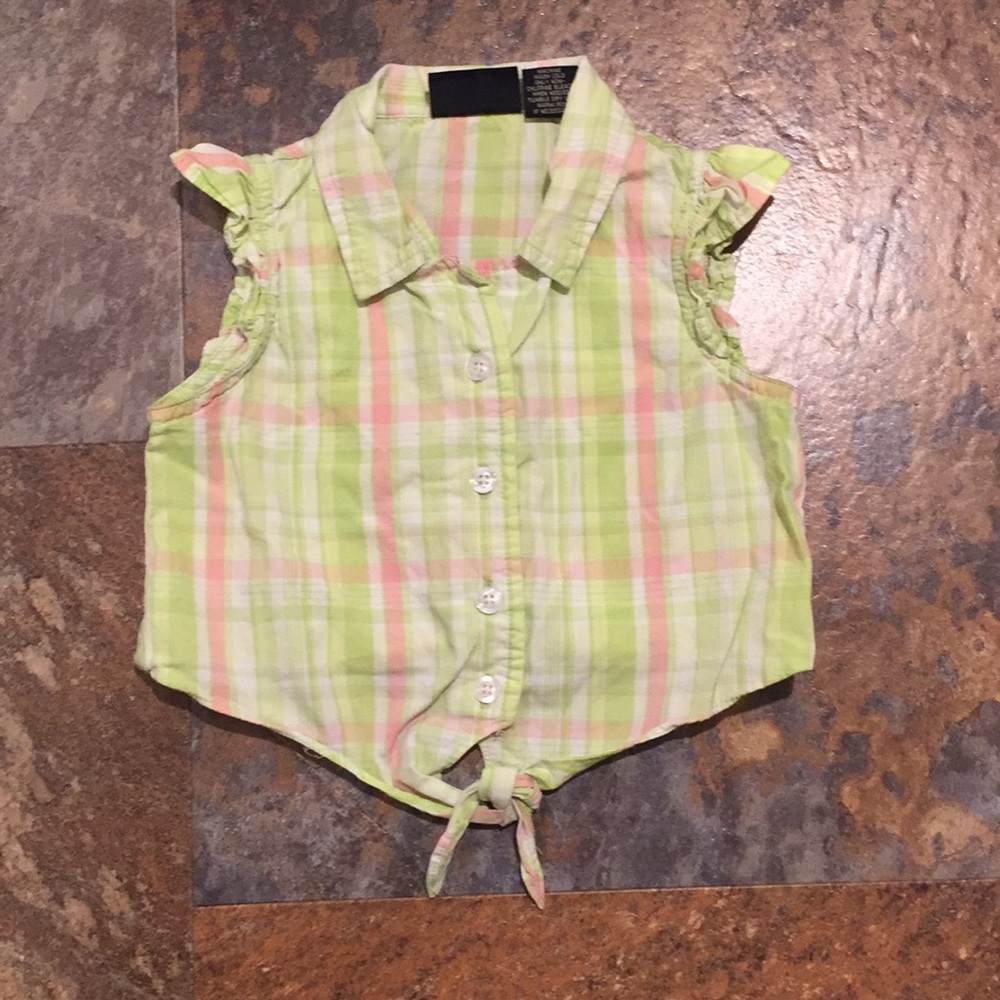 Girls button up sleeveless shirt.